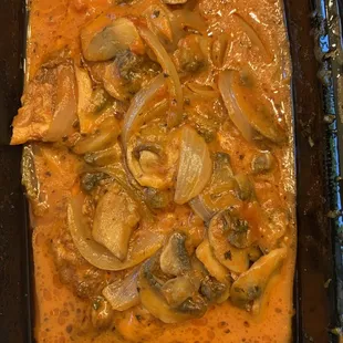 a casserole with mushrooms and onions