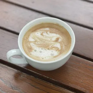 Tiny vanilla latte with almond milk.  Latte
