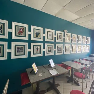 a wall of framed photos