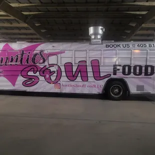 a tour bus parked in a garage