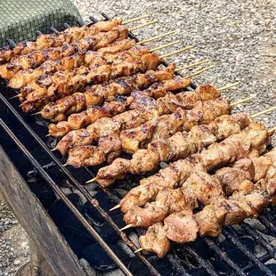 Chicken or pork bbq sticks. They are $3 and cash only.