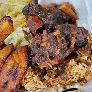 Oxtails, rice, cabbage and plantains.....oh my