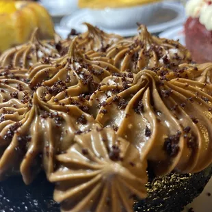 chocolate frosting on a cake