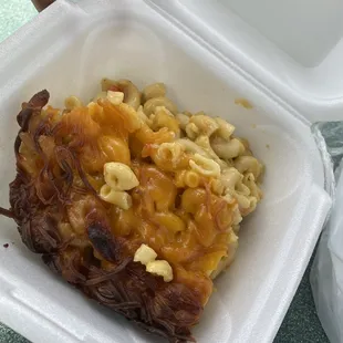 macaroni and cheese in a styrofoam container