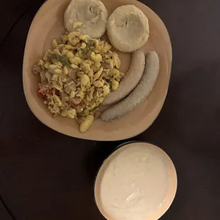 Ackees and salt fish with food accompanied by foursome porridge.