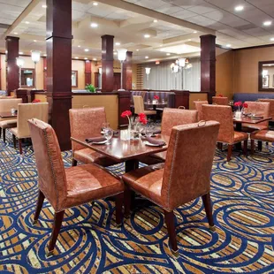 a dining area with seating and tables