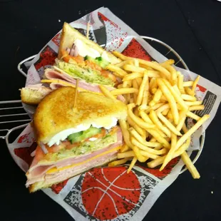Signature Chef Salad Sandwich: Turkey, Ham, Swiss, Cheddar, Lettuce, Tomato, Cucumber, hard-boiled eggs on toasted sourdough.