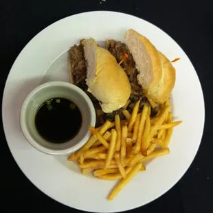 Roast Prime Rib Sandwich with Carmelized onions, mushrooms, and provolone cheese. Served with Au Jus for dipping.