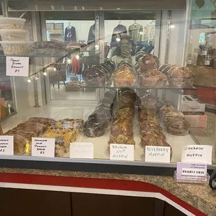 a variety of pastries in a display case