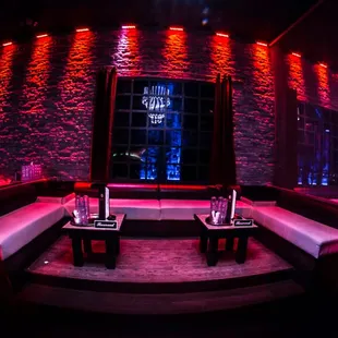 a dimly lit room with red lighting