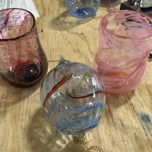 Hand blown glass cups we made in class as well as a glass hot air balloon made by instructor, John. Absolute blast of a time!