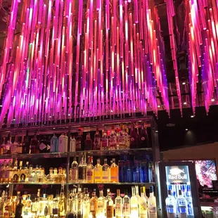 a bar filled with bottles of alcohol