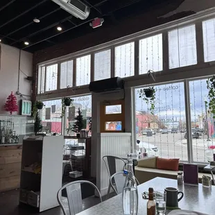 a view of a dining room with large windows