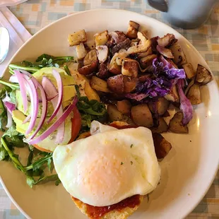 Veggie muffin with over easy egg and potato hash