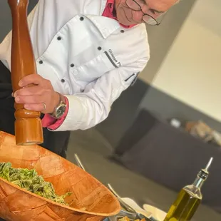a chef preparing a meal in a kitchen