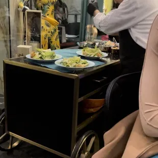 Tableside Caesar salad service