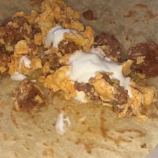 Chorizo con huevo topped with our mexican sour cream!