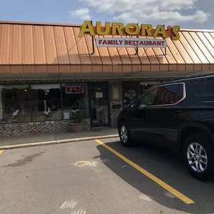 a car parked in front of the restaurant