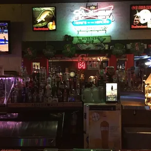 a bar with neon signs