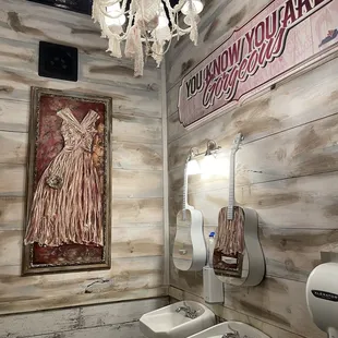 Nicely decorated, clean Ladies bathroom.  Mirrors were guitars !!