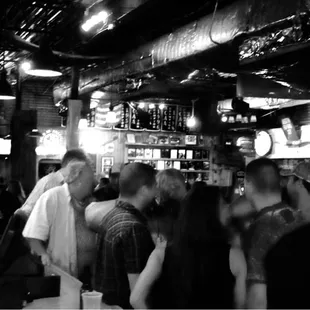 a crowd of people at a bar
