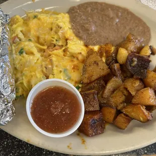 Migas, refried beans, seasoned roasted potatoes (home fries), tortillas