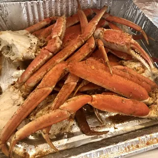 crab legs in a foil pan