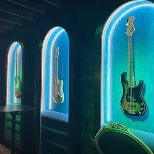 a row of guitars on display