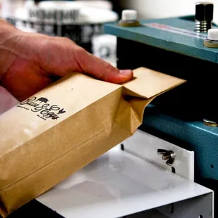 a person opening a bag of food