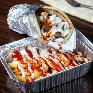  a burrito with ketchup and sauce