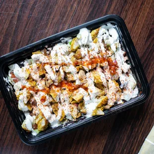 a dish of chicken and cheese