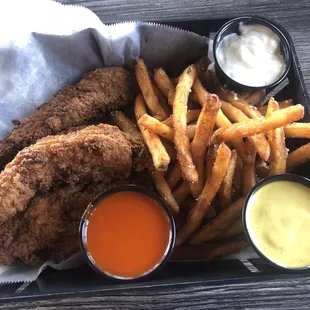 4 chicken tenders and fries with buffalo sauce, honey mustard and blue cheese dressing