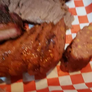 a plate of meat and sides