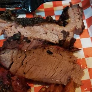 a plate of meat and sides