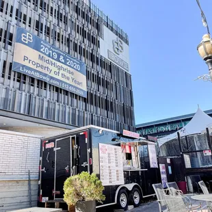 The food truck and outdoor seating areas.