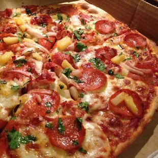 The Haole pizza. Pepperoni, bacon, cilantro, pineapple, red onions, and mozzarella.