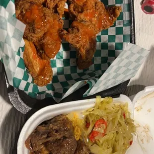 Ox tails, yellow rice, macaroni and cabbage, chicken