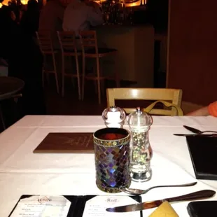 Table set up, nice dim lighting, bar in background