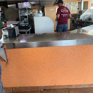 a man standing at a counter