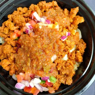 $12 pork bowl , 90% rice and vegetables -primarily onions and tomatoes