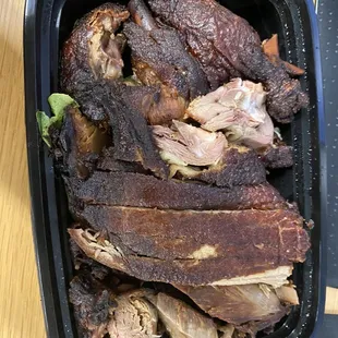 meat in a black container