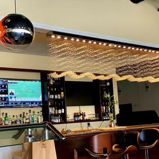 a view of a bar with a television in the background