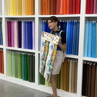 Showing off her pillowcase she made for her cat