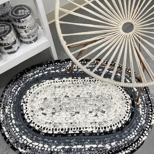 Black and white jelly roll rug.