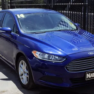 2014 Ford Fusion 4 cylinder with lots of room for a family.