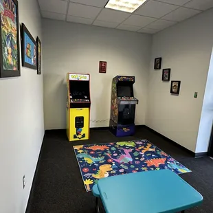 The kiddos can have fun playing some retro arcade games while you wait.