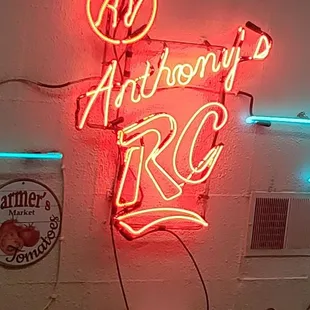 a neon sign on a wall