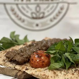 a flatbread with meat and vegetables