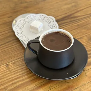a cup of hot chocolate on a saucer