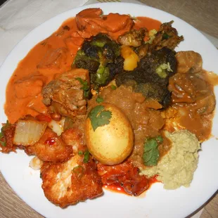 buffet food. Curry,egg,tikka masala,butter chicken,rice